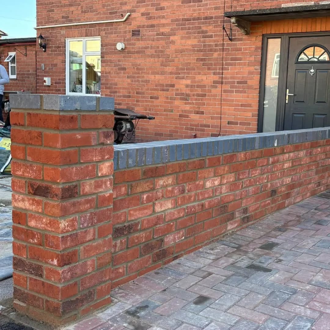 A multi red brick wall and pier with blue brick coping, Wyesham